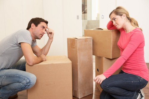 Office relocation service with desks and equipment being moved